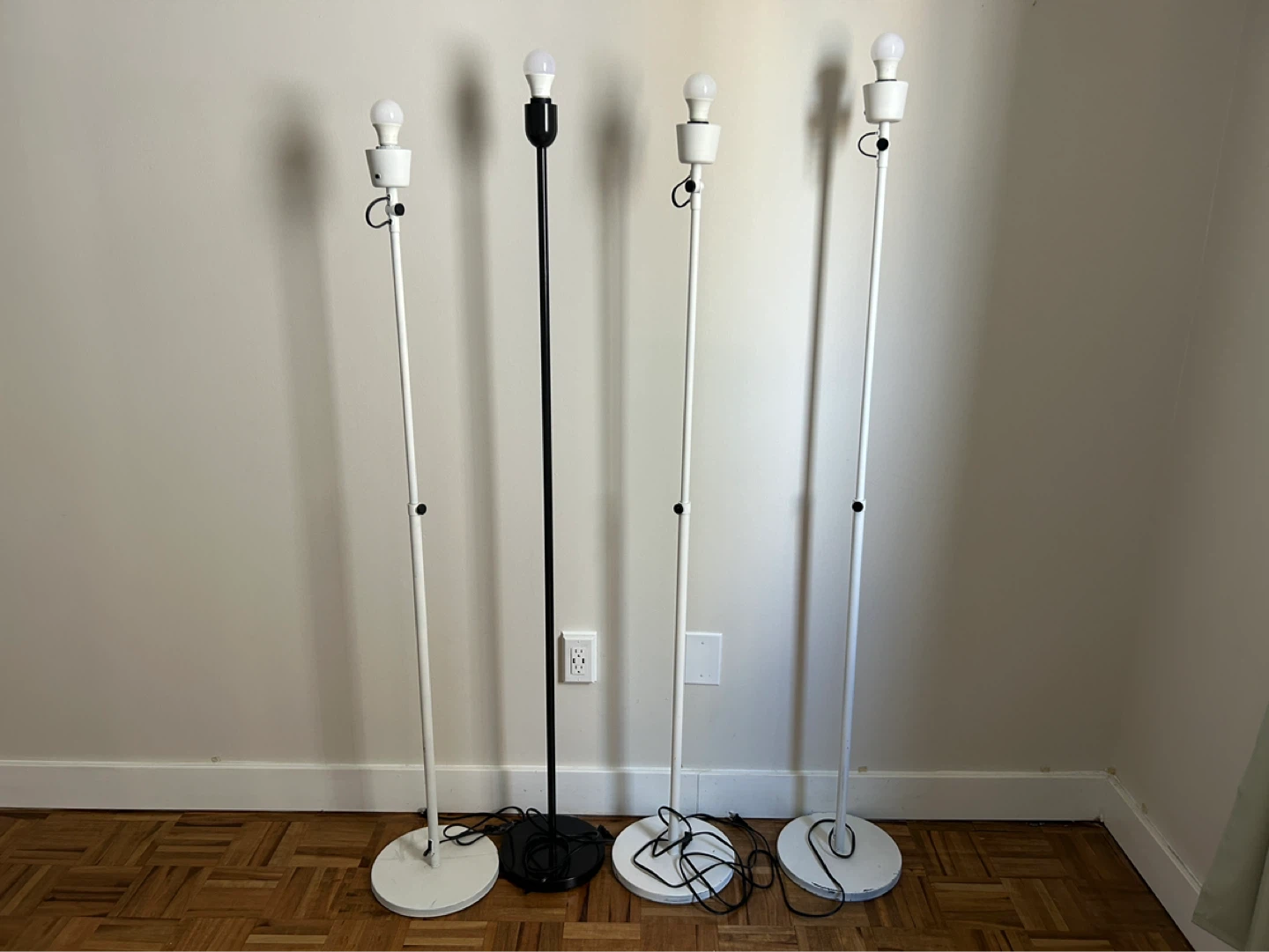 4 Floor Lamps (3 White, 1 Black)
