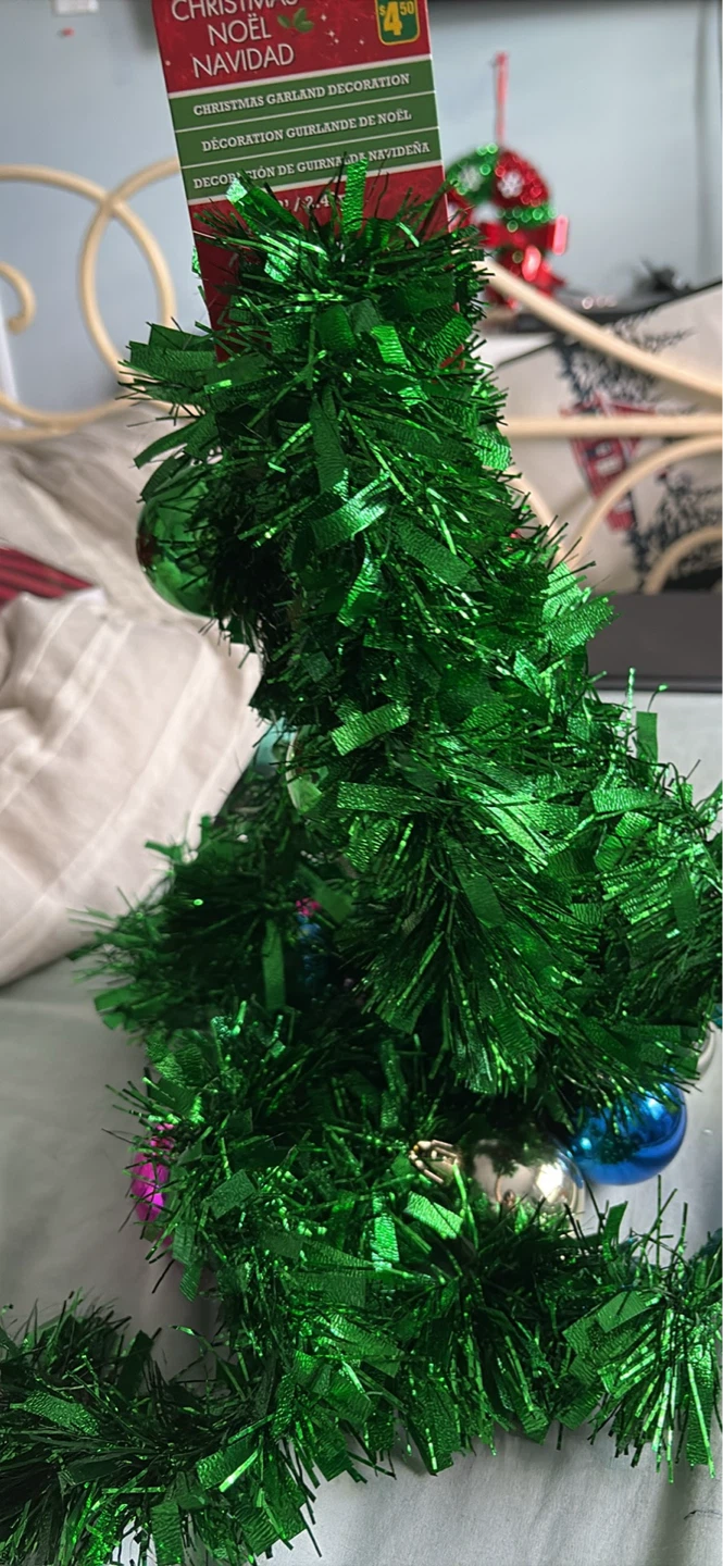 Christmas green garland. With ornaments tags on