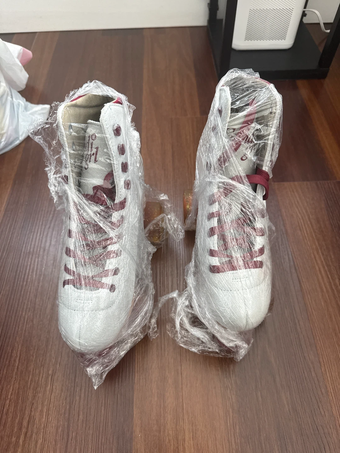 White and Burgundy Roller Skates