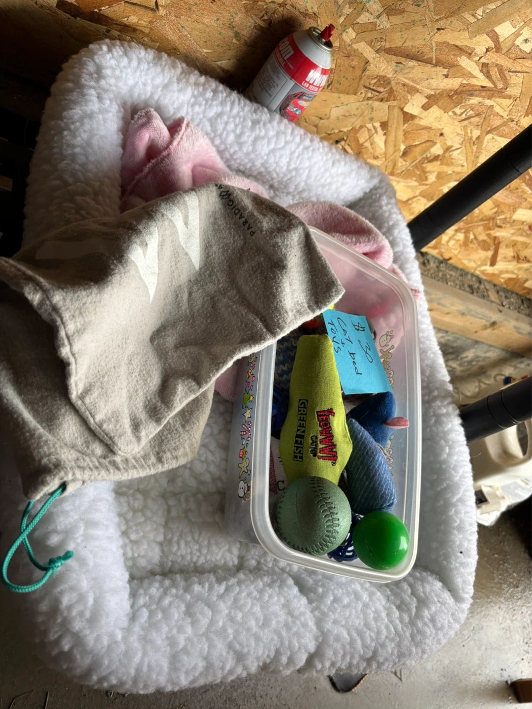 Assorted Cat Toys and Small Pet Bed
