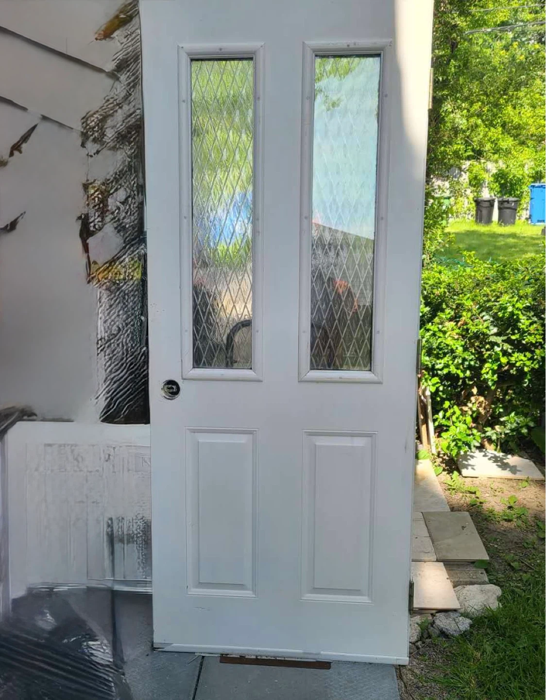 White Exterior Door with Diamond Glass Panes