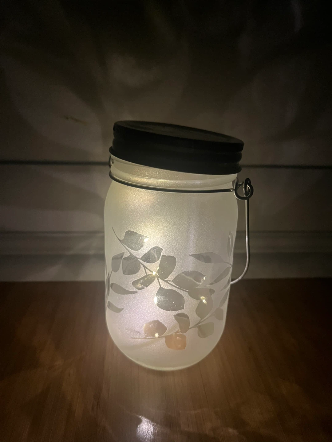 A pair of Frosted Glass Mason Jar Lantern with LED Lights
