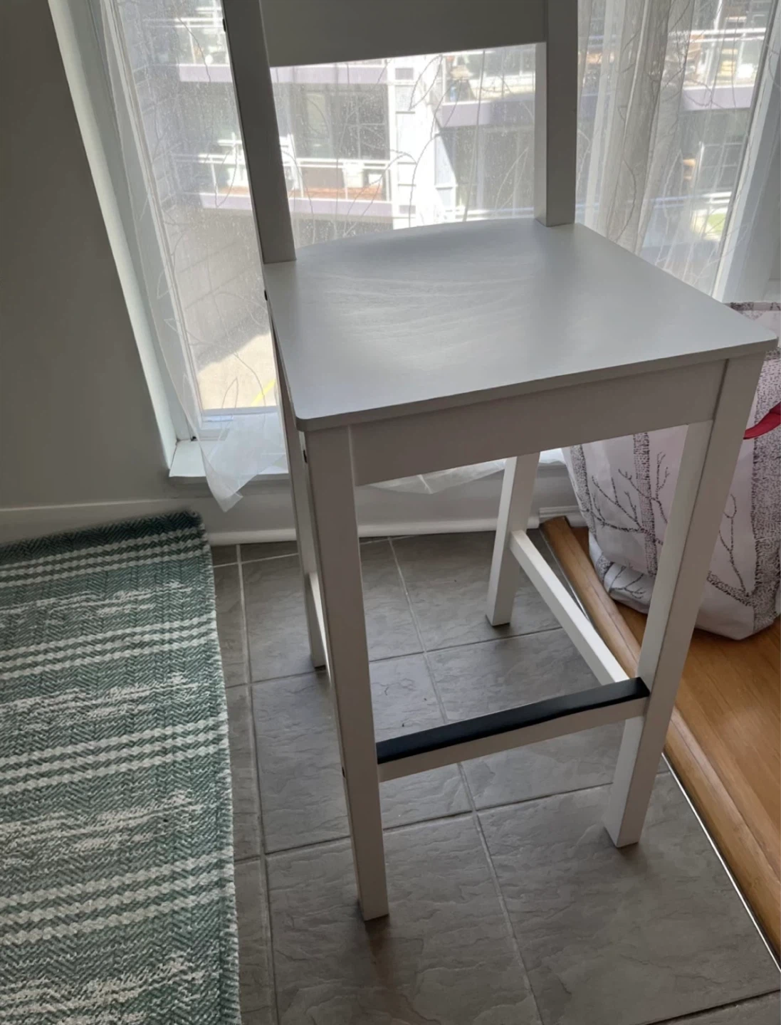 A pair of IKEA White Bar Stools