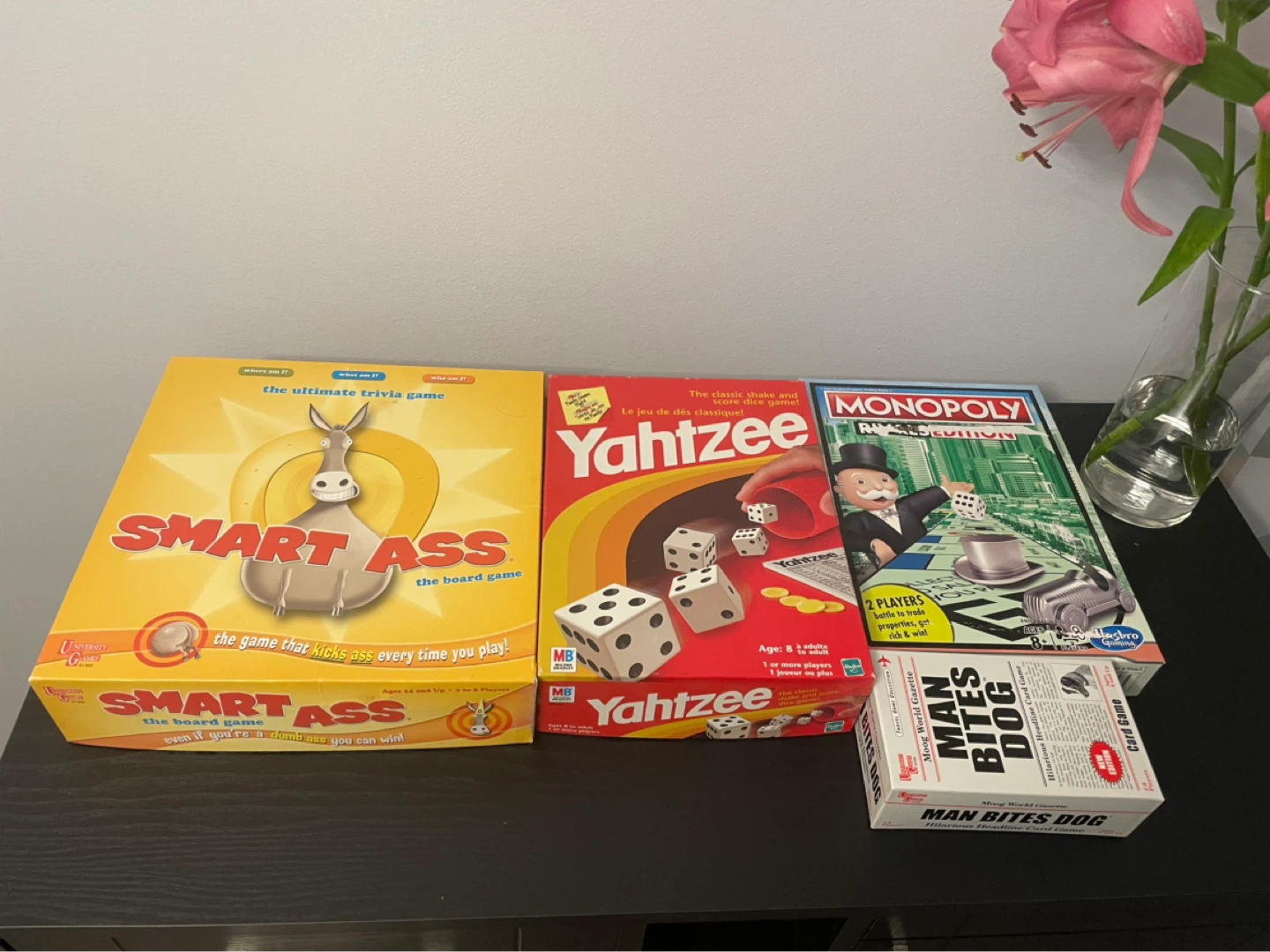 Smart Ass, Yahtzee, Monopoly, and Man Bites Dog Board Games