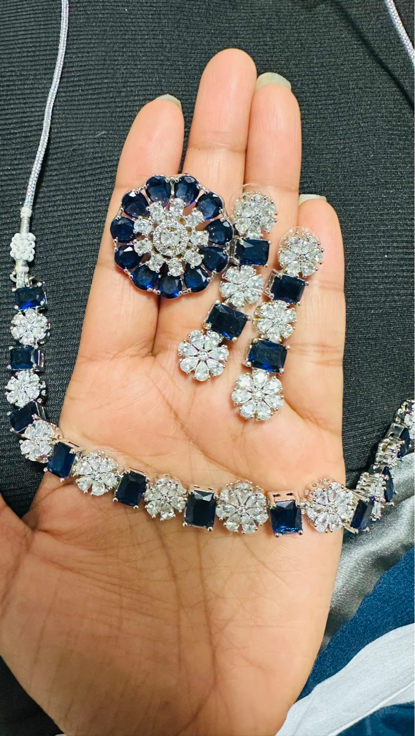Blue and clear gemstone necklace and earring set