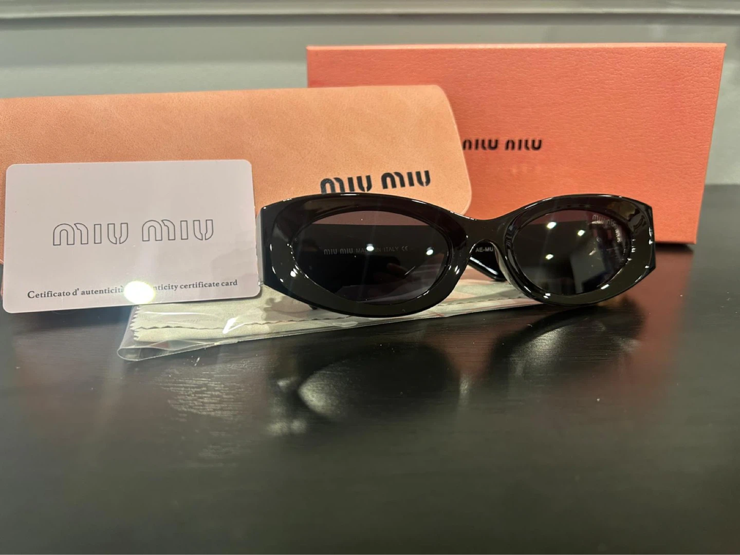 Miu Miu Black Oval Sunglasses