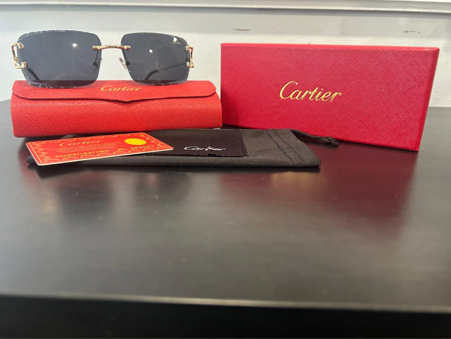 Black Cartier Rimless Sunglasses with Red Case and Box