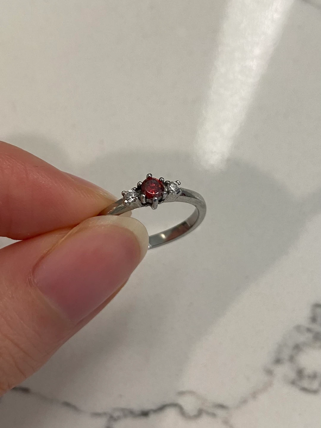 Size 3.5 titanium ring with natural garnet and white sapphire