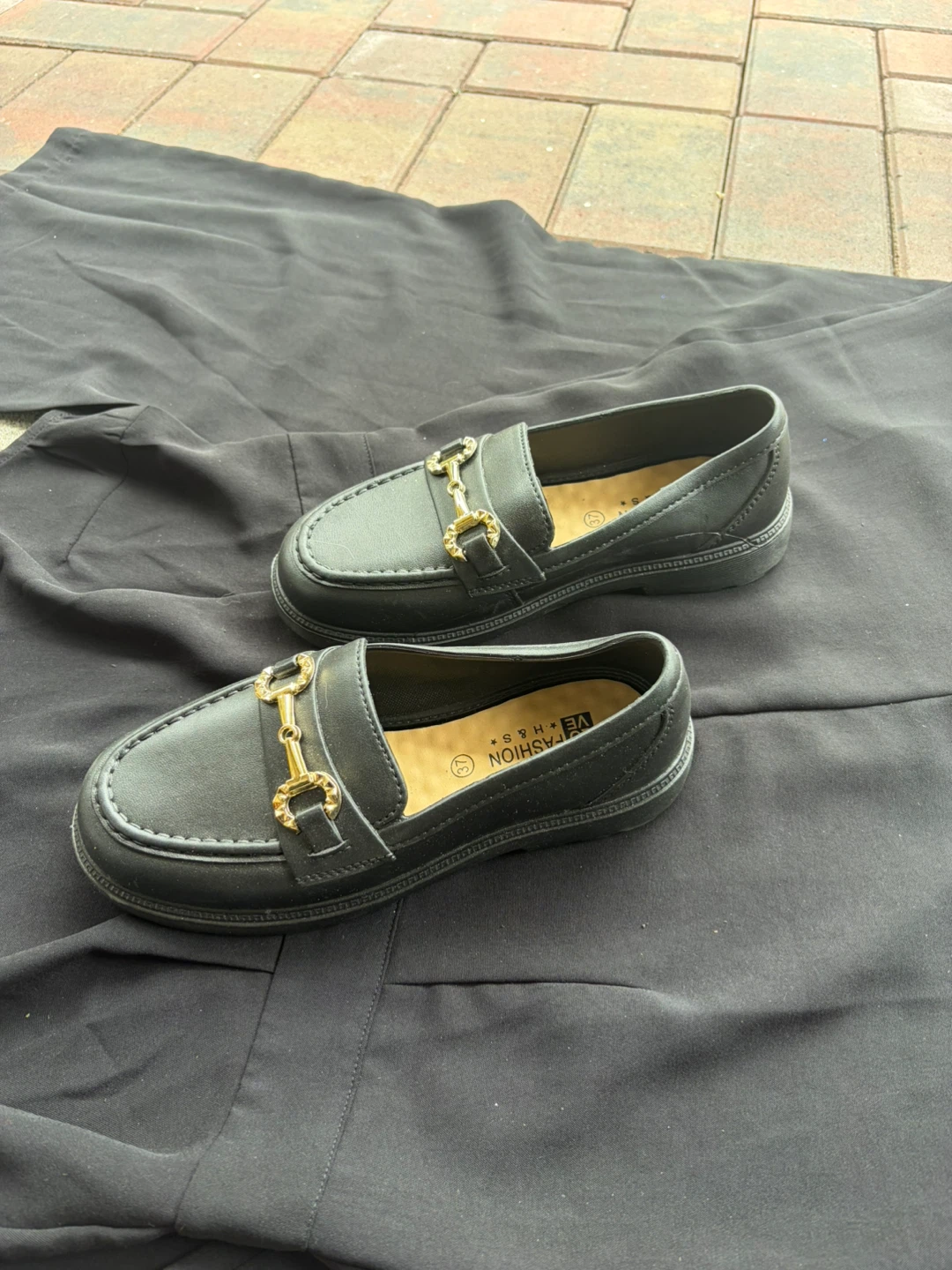 Black Loafers with Gold Buckle