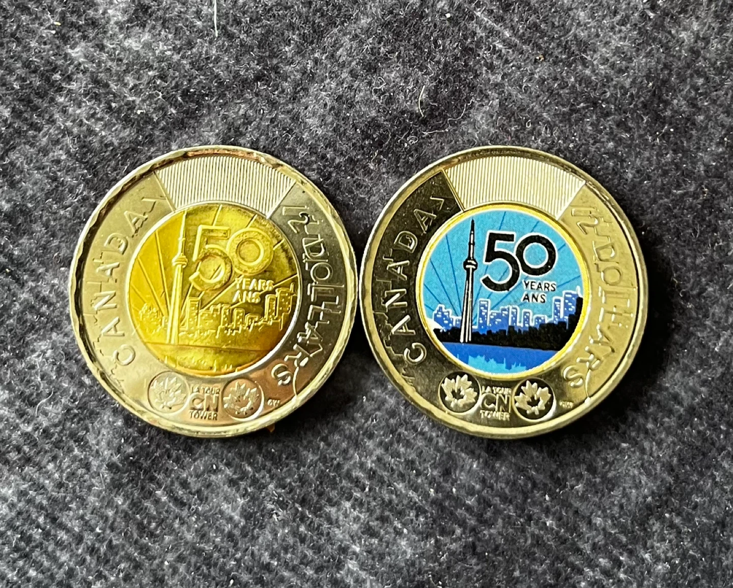 Two Canadian $2 coins - Charles III & CN Tower