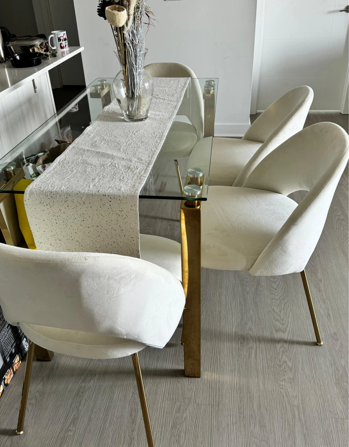 Glass Dining Table with Gold Legs and 4 Cream Chairs