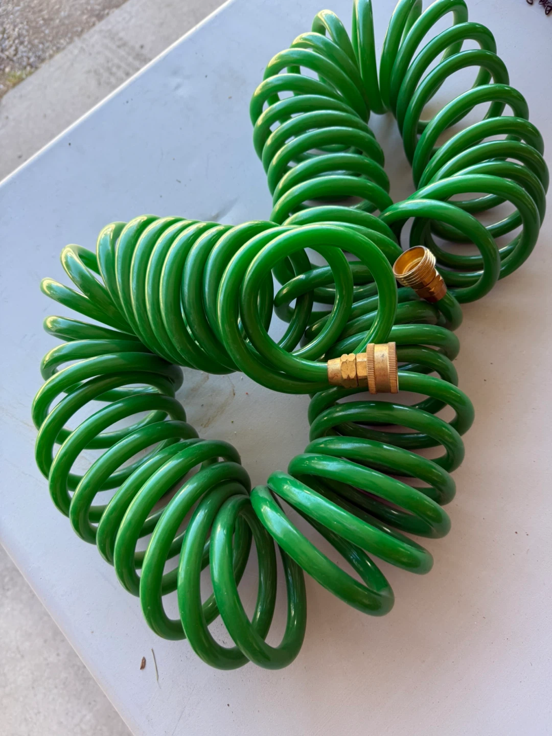 Green Coiled Garden Hose