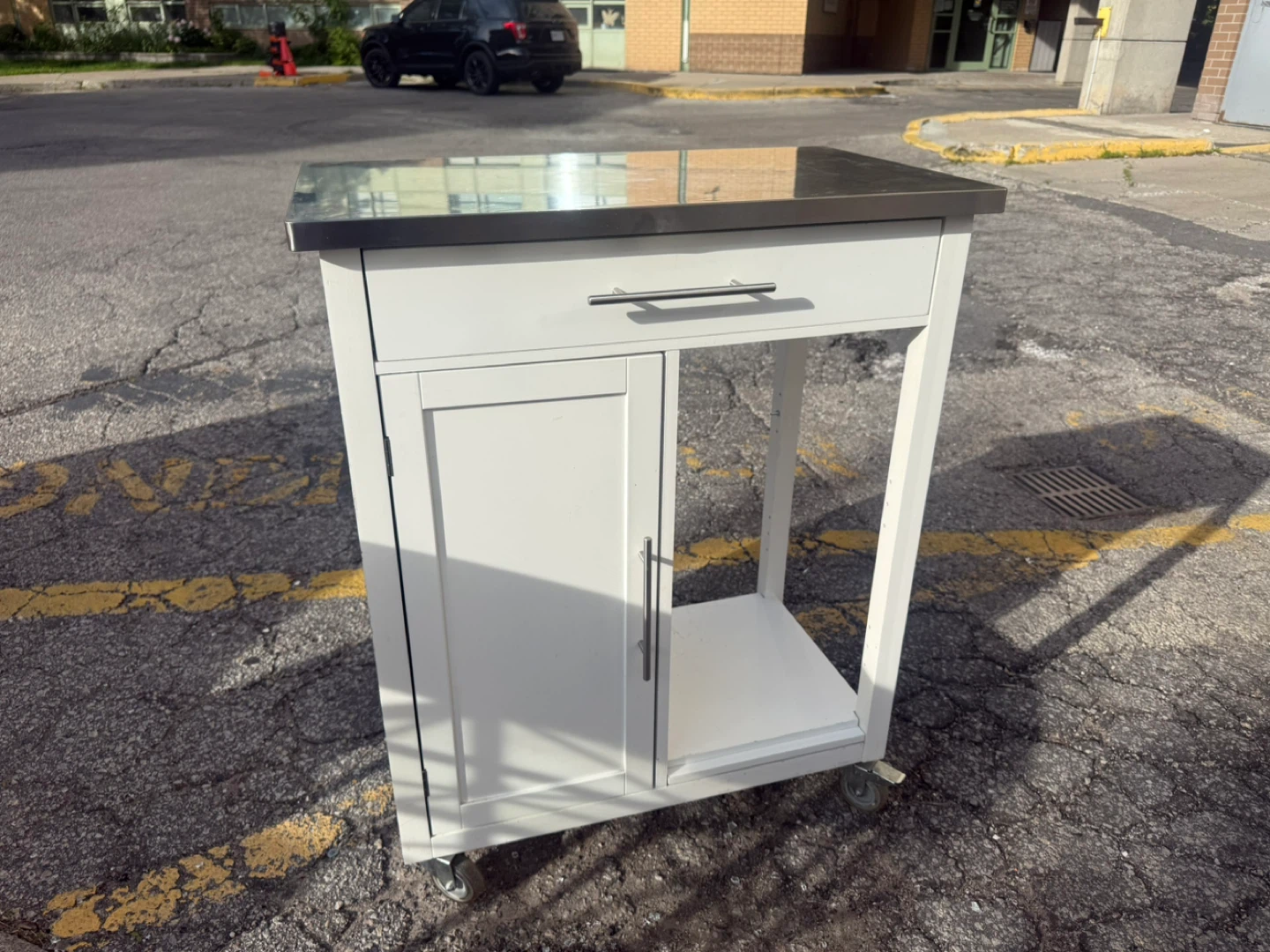 White kitchen cart with stainless steel top
