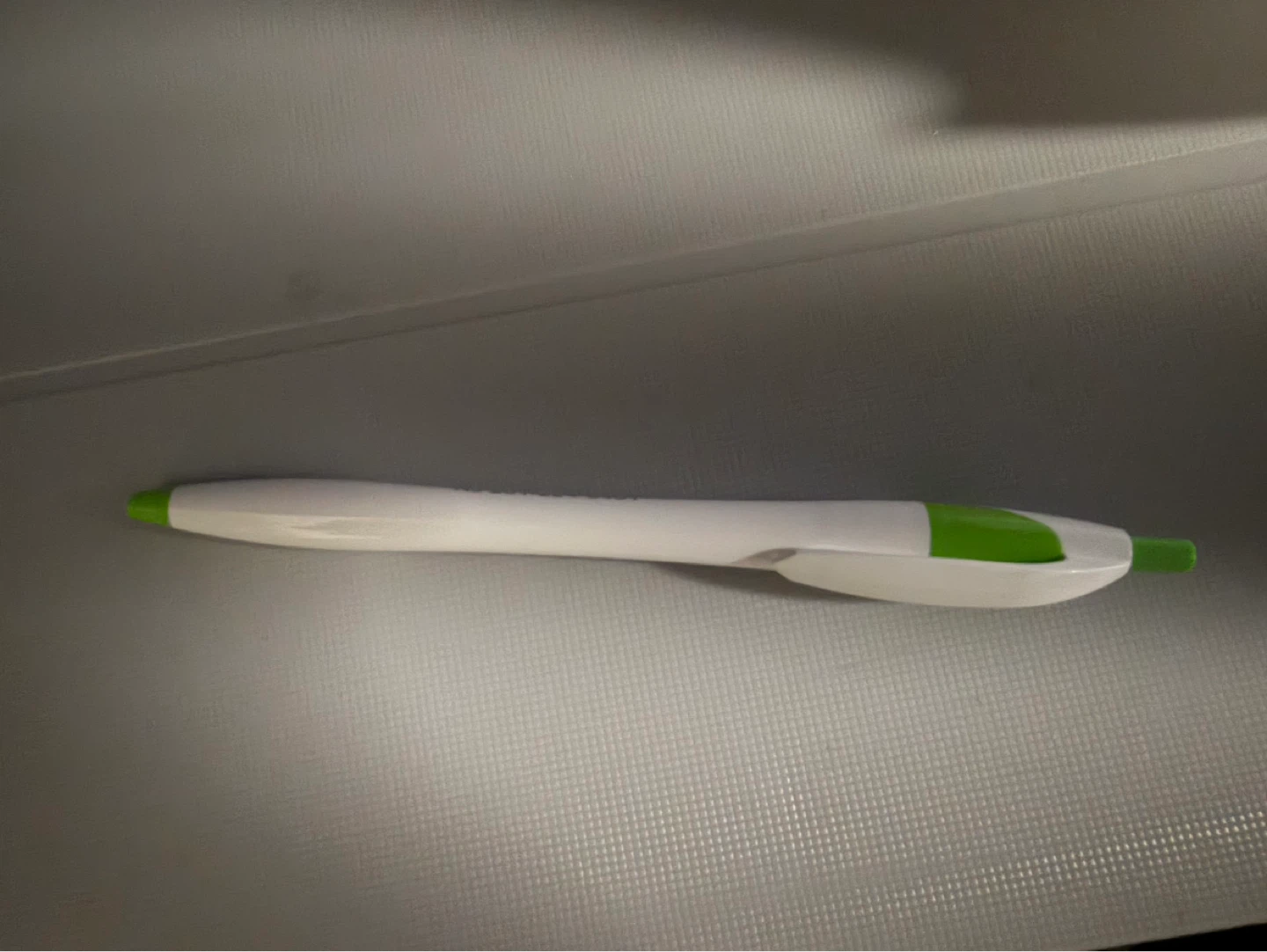 White and Green Ballpoint Pen