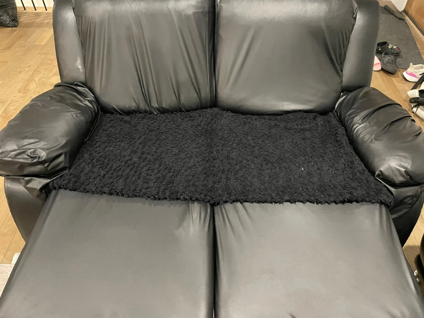 Black faux leather loveseat