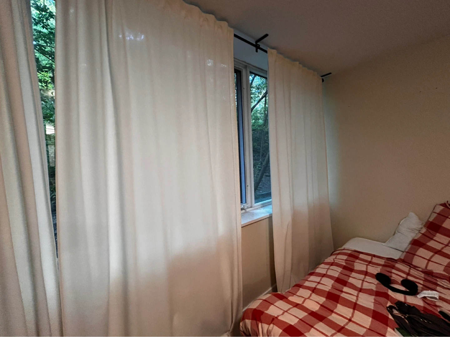 Large off-white curtains and rails