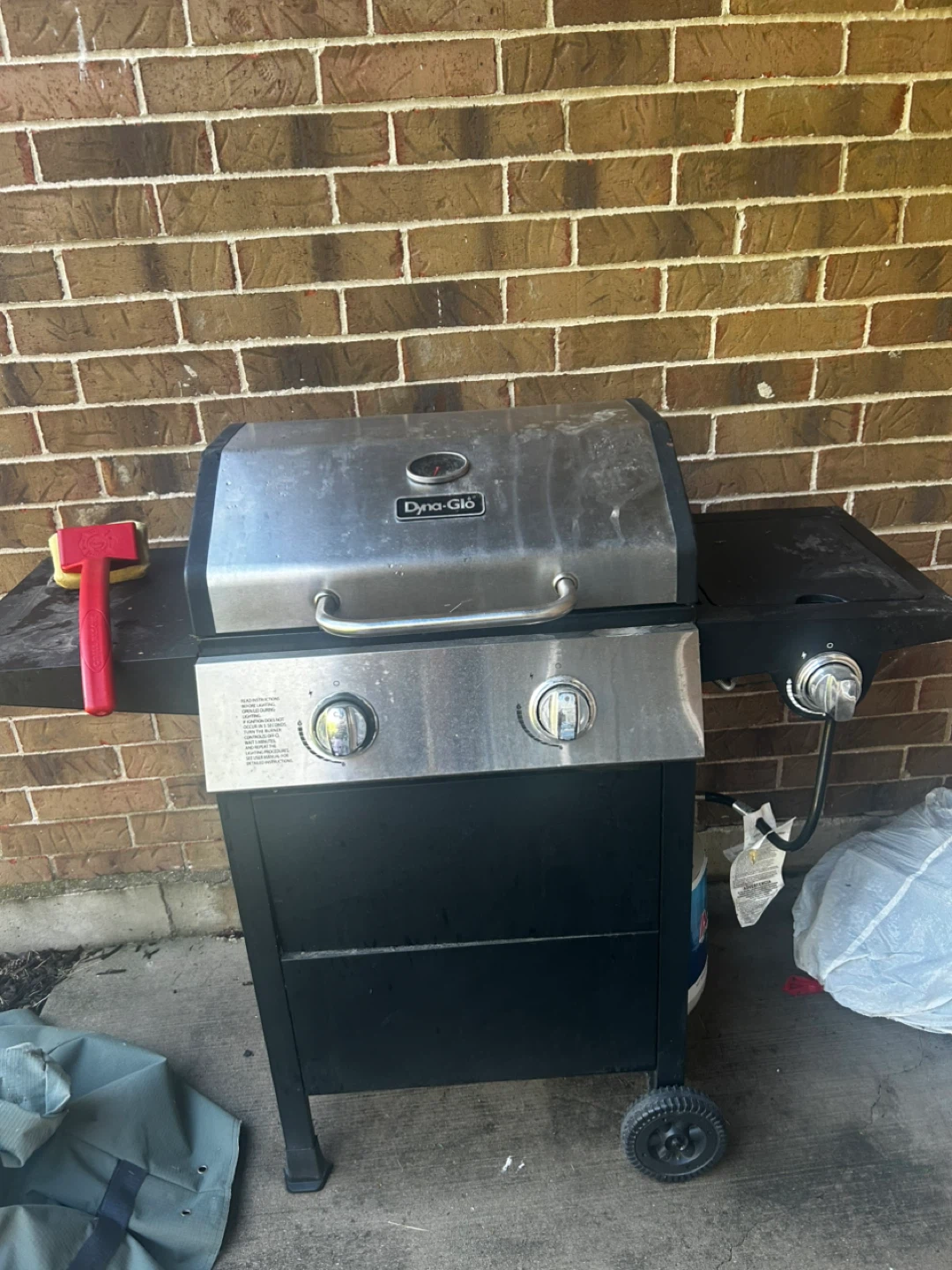 Gas grill with cover and propane tank