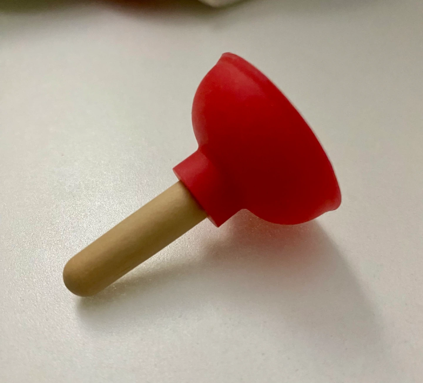 Red and Wood Toy Plunger