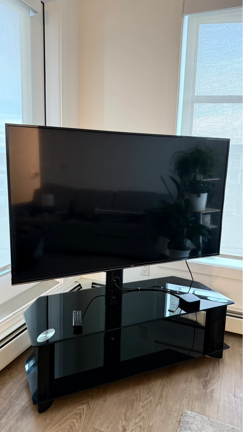 65” LG Smart TV + Modern Glass TV Stand + Apple TV Included - photo 2