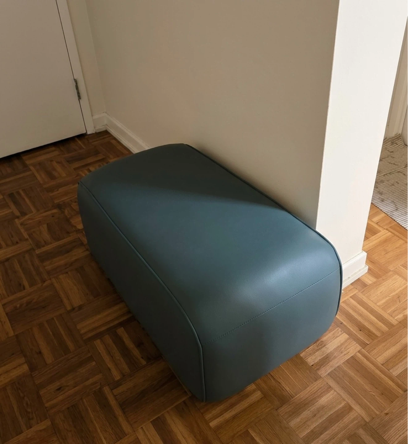 Teal upholstered ottoman
