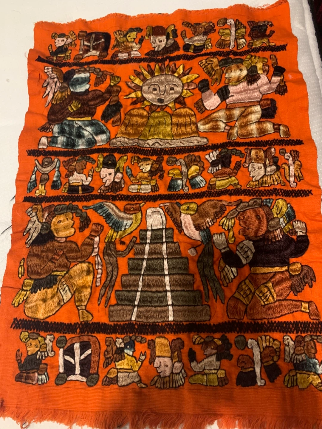 Orange Woven Textile with Mayan Motifs