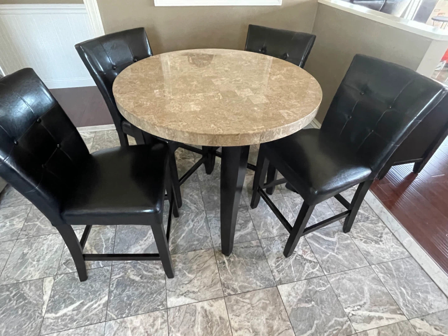 Round Marble Top Table with 4 Black Faux Leather Chairs