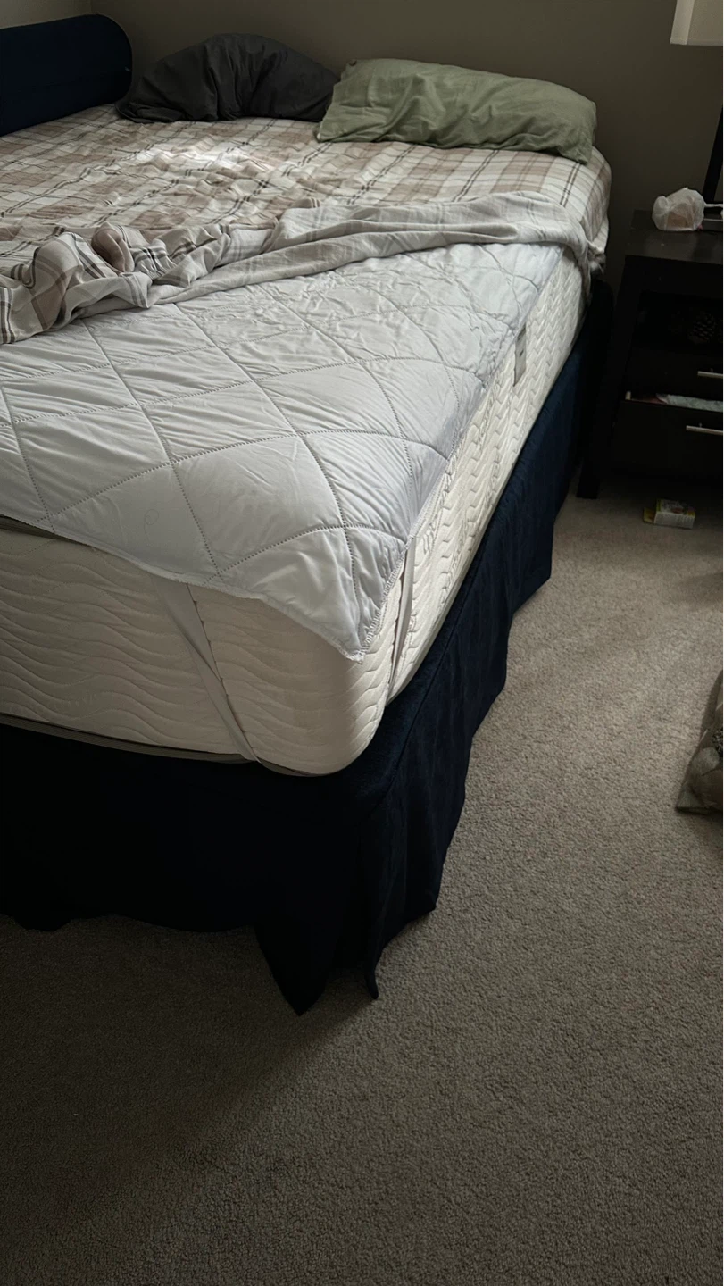 Mattress with dark blue bed skirt perfect condition hotel bed.