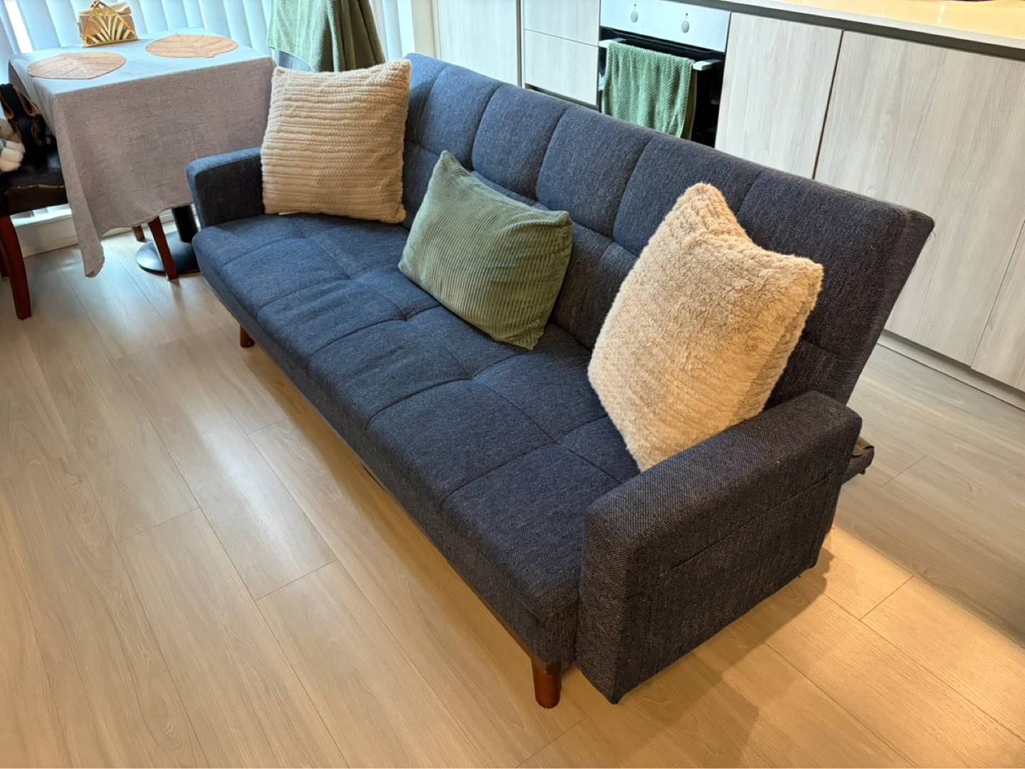 Dark Blue Sofa Bed with Tufted Cushions