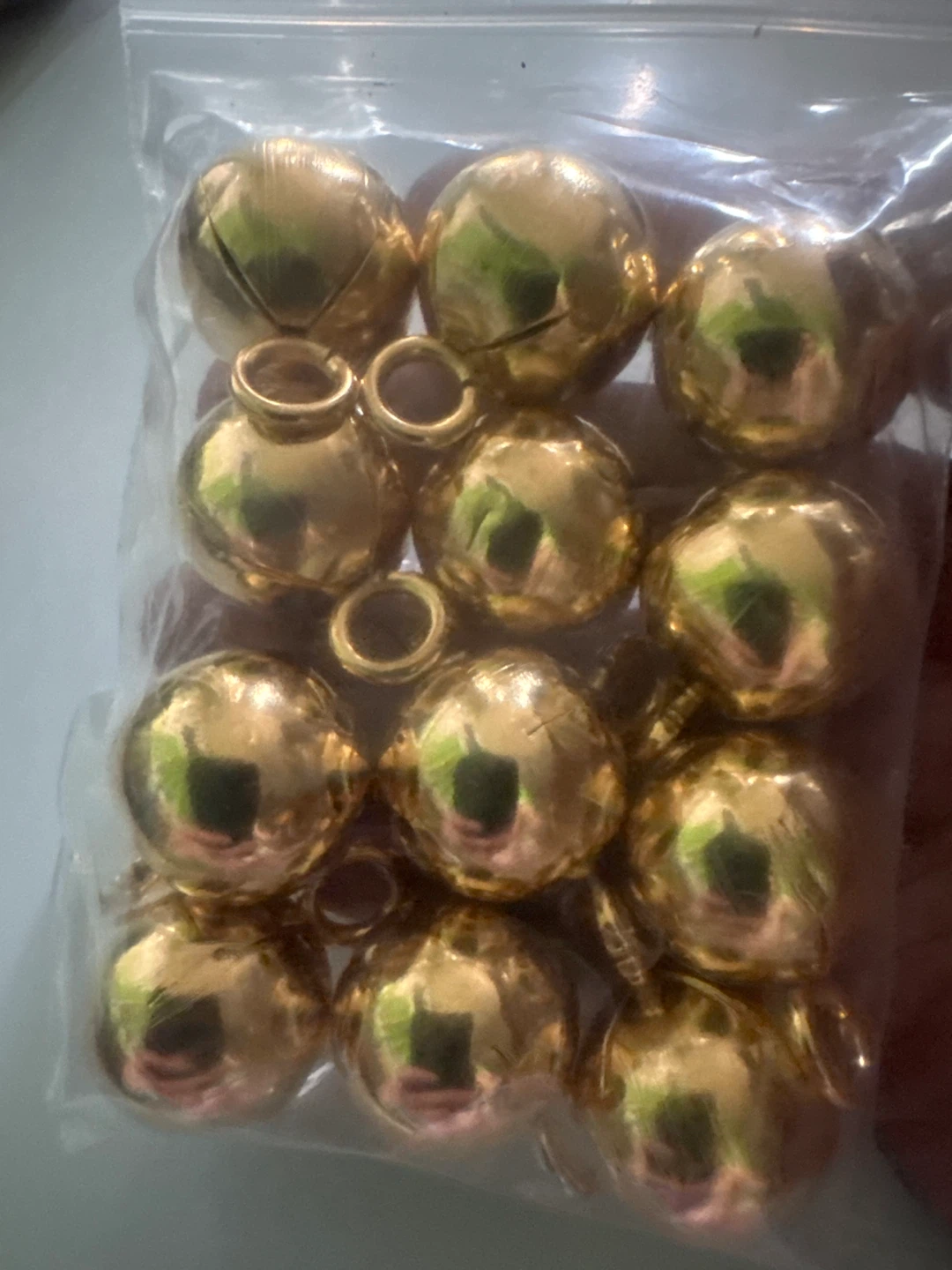 12 Gold tone Hallow balls  with Ring and a hole
