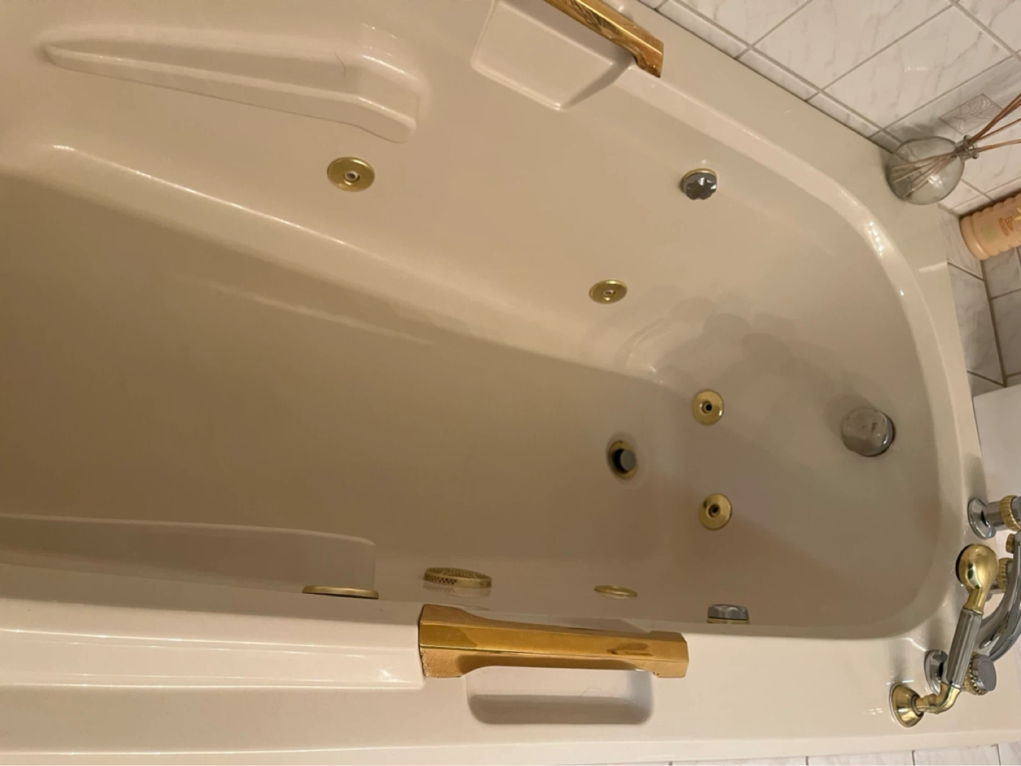 Jetted Bathtub with Pillow and Gold Accents - photo 4