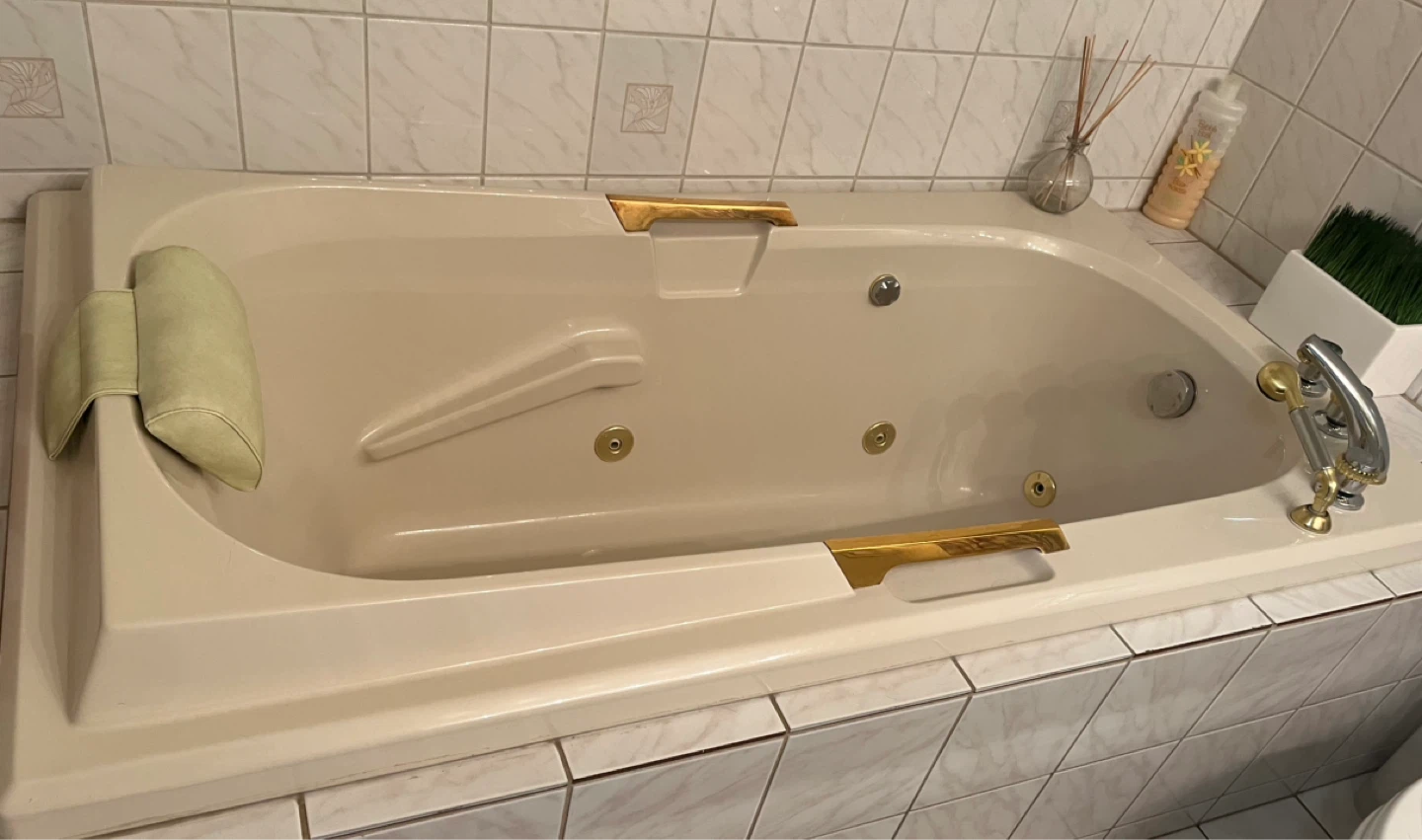 Jetted Bathtub with Pillow and Gold Accents - photo 2