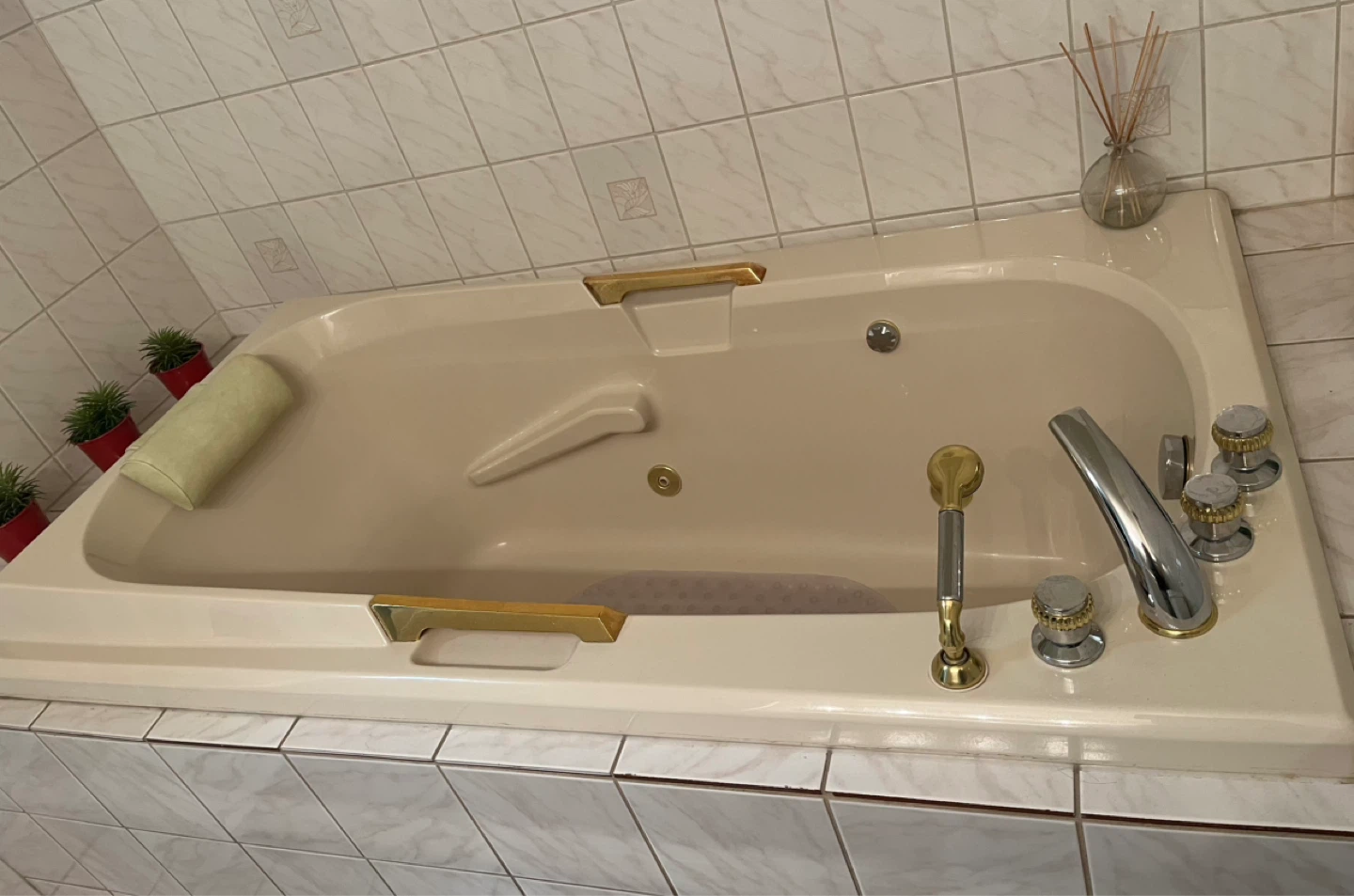 Jetted Bathtub with Pillow and Gold Accents - photo 3