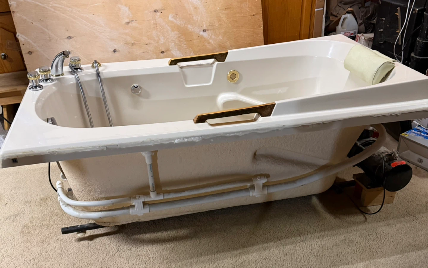 Jetted Bathtub with Pillow and Gold Accents