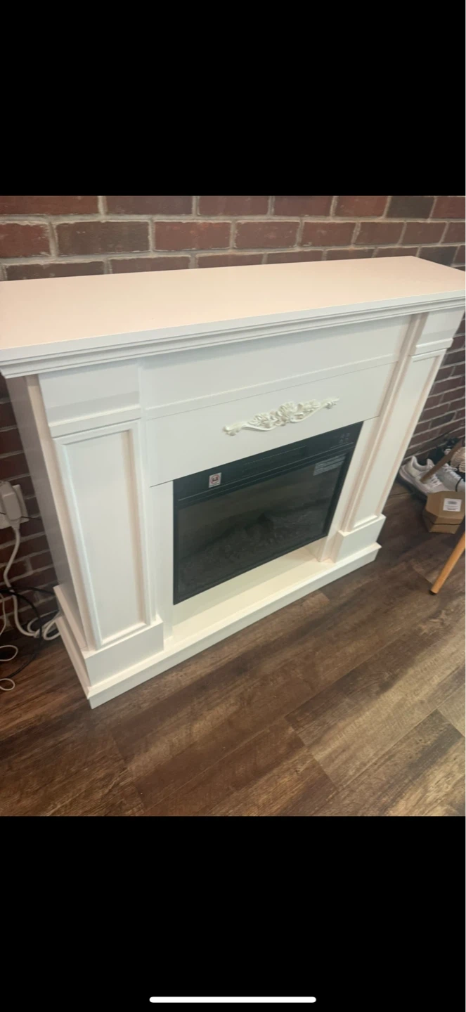 White Electric Fireplace and Blue Cabinet