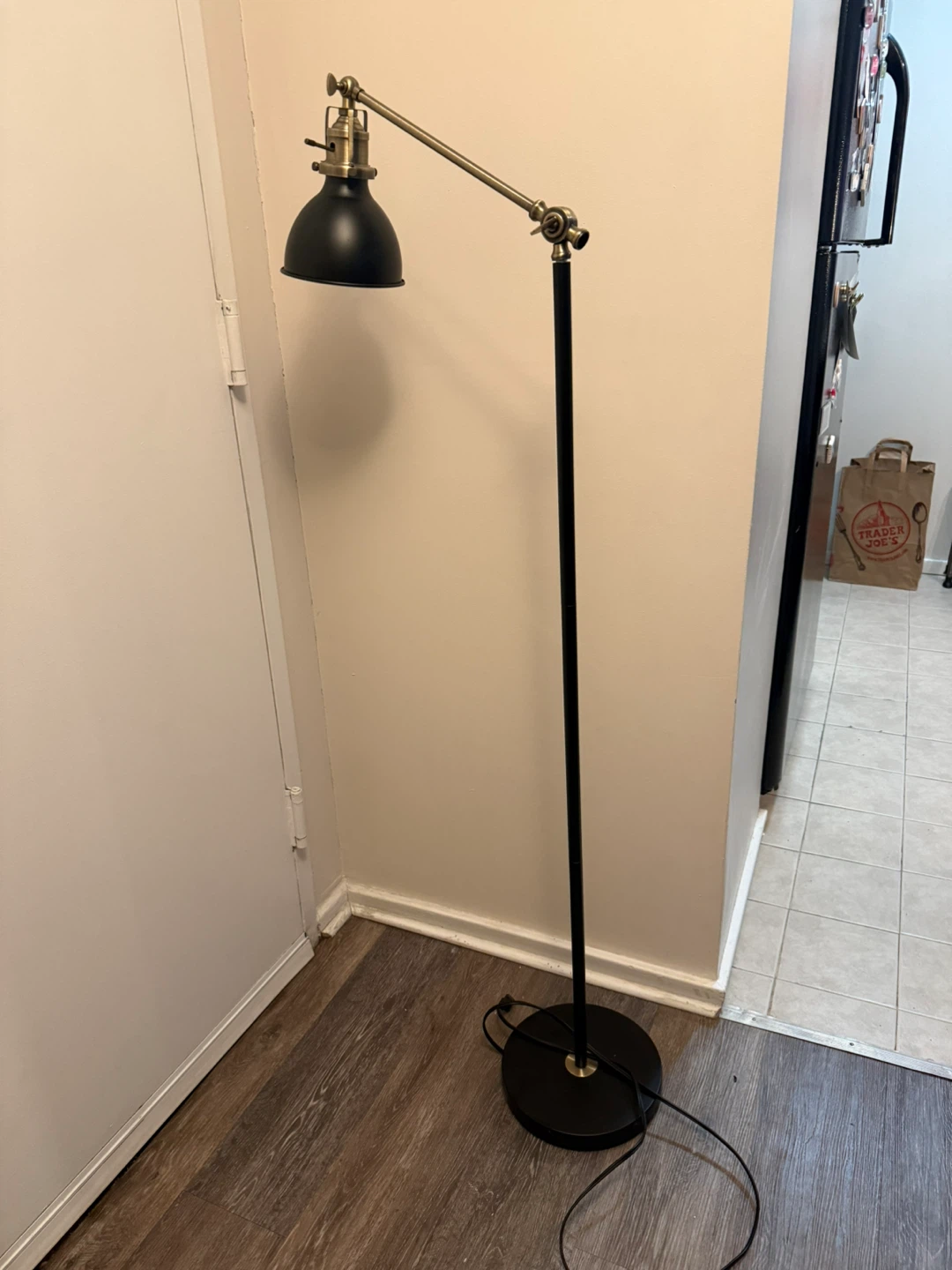 Black Adjustable Floor Lamp with Brass Accents