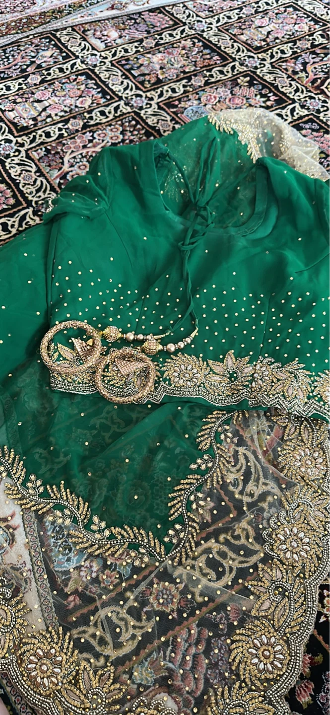 Green and gold sari