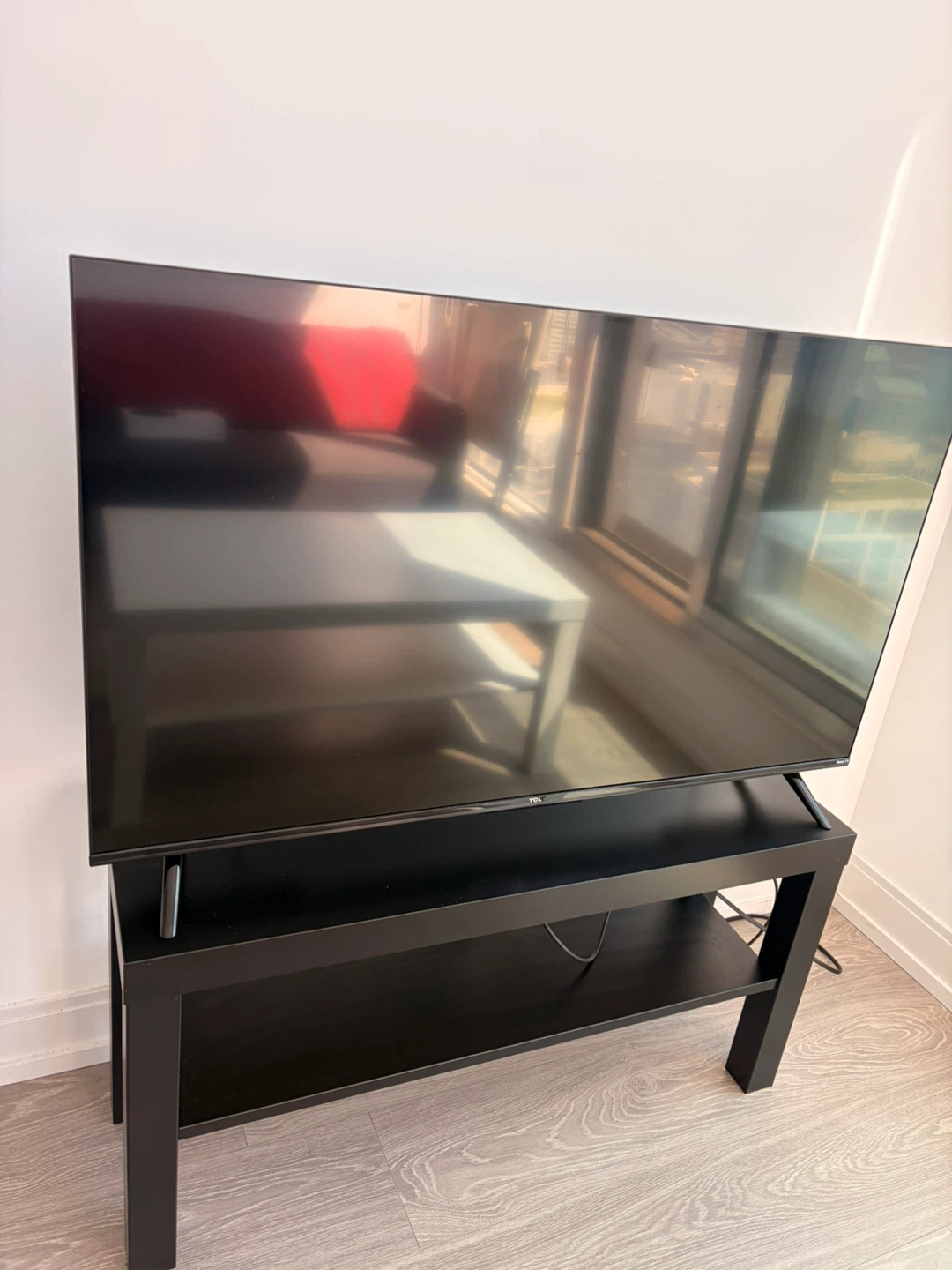 TCL Smart TV on Black TV Stand