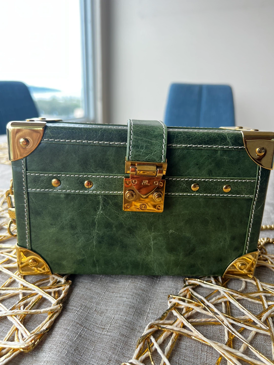 Limited edition Green trunk-style clutch with gold chain