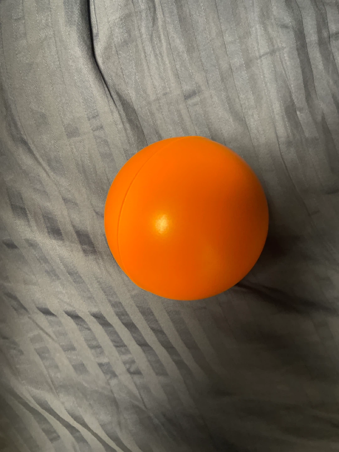 Orange stress hand relief Play Ball