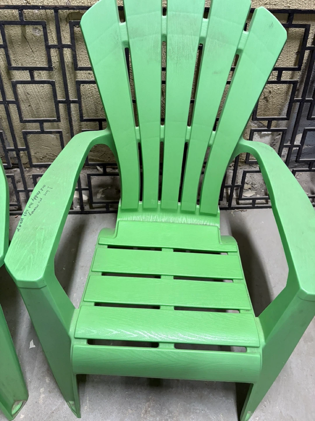 Two Green Adirondack Chairs