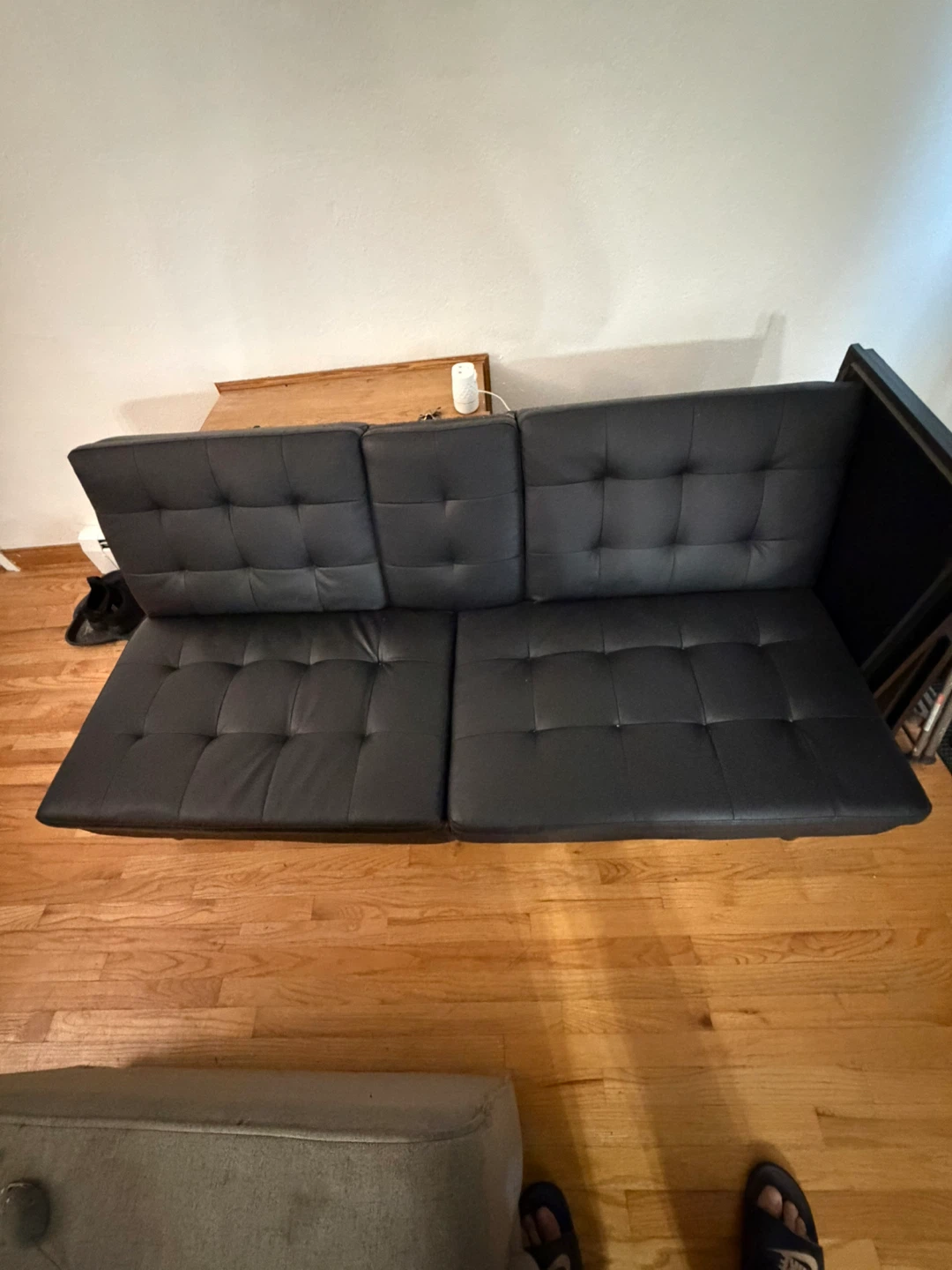 FREE Black Faux Leather Futon Sofa with Cupholders