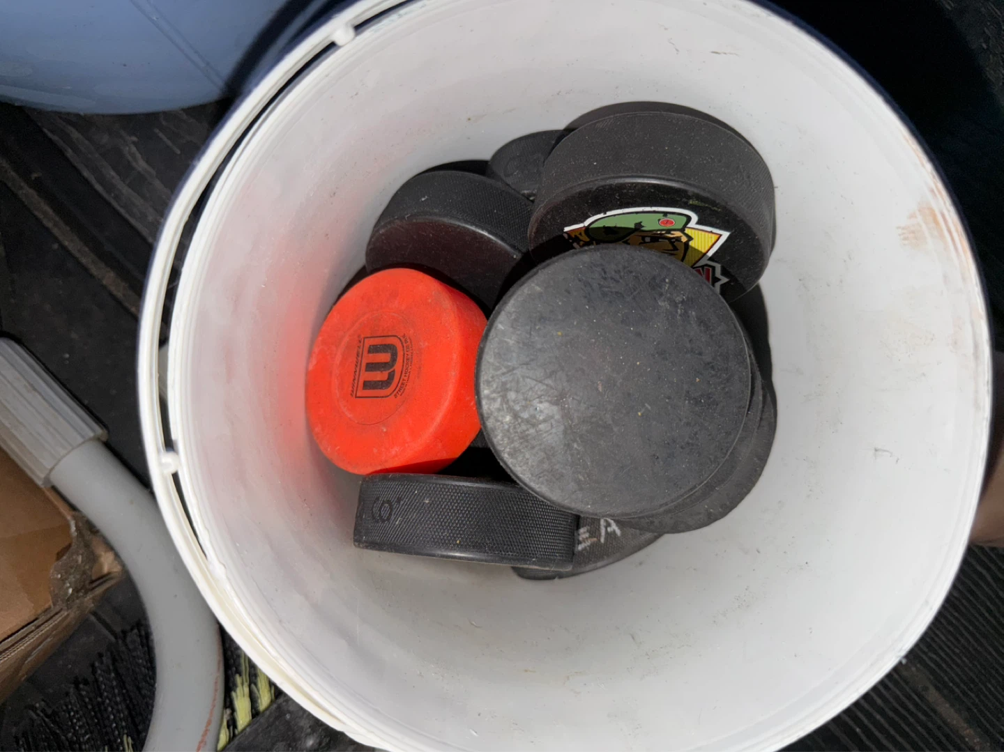Bucket of Hockey Pucks