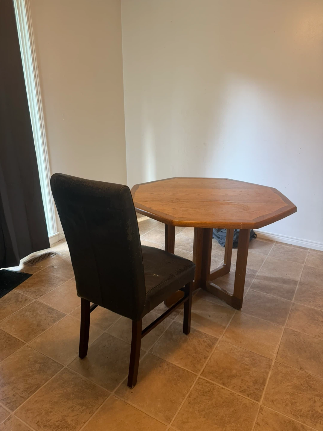 Free small wooden dining table with two chairs.