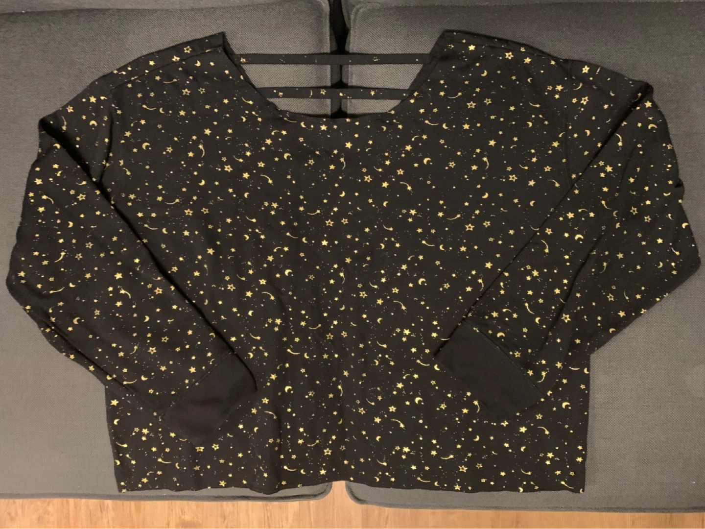 Black long sleeve top with gold stars and moons
