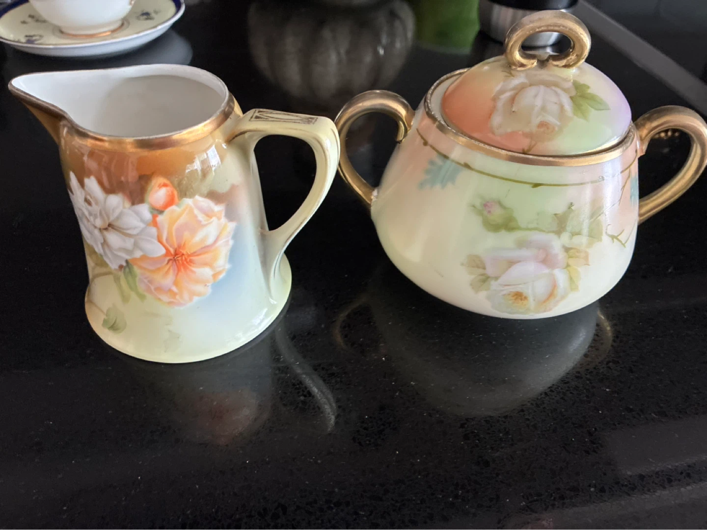 Vintage Teacup, Saucer, Creamer, and Sugar Bowl Set