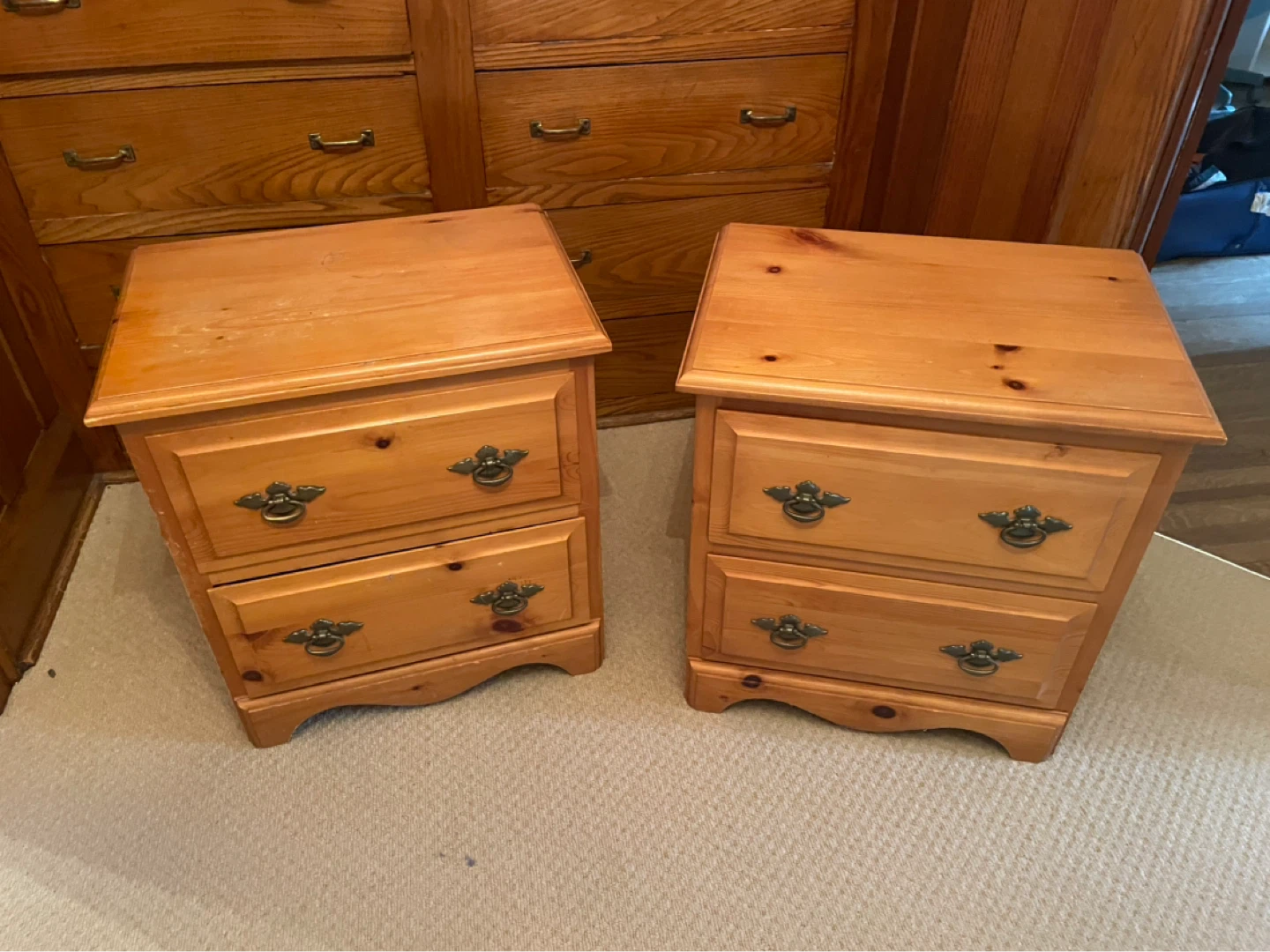 Two wooden nightstands with drawers