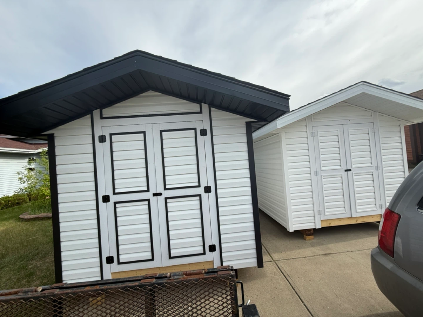 White Storage Shed with Black Trim