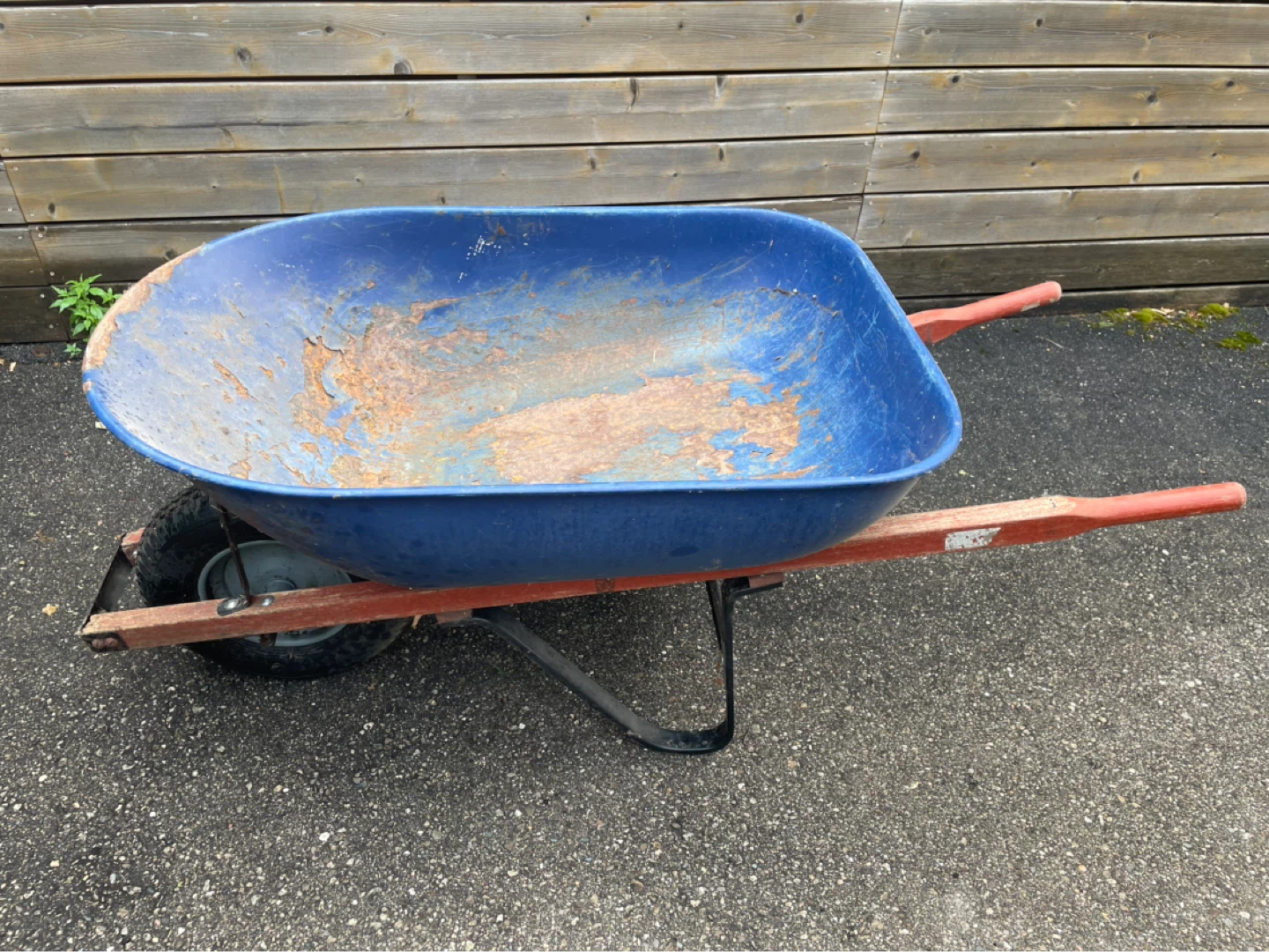 Blue Wheelbarrow with Wooden Handles