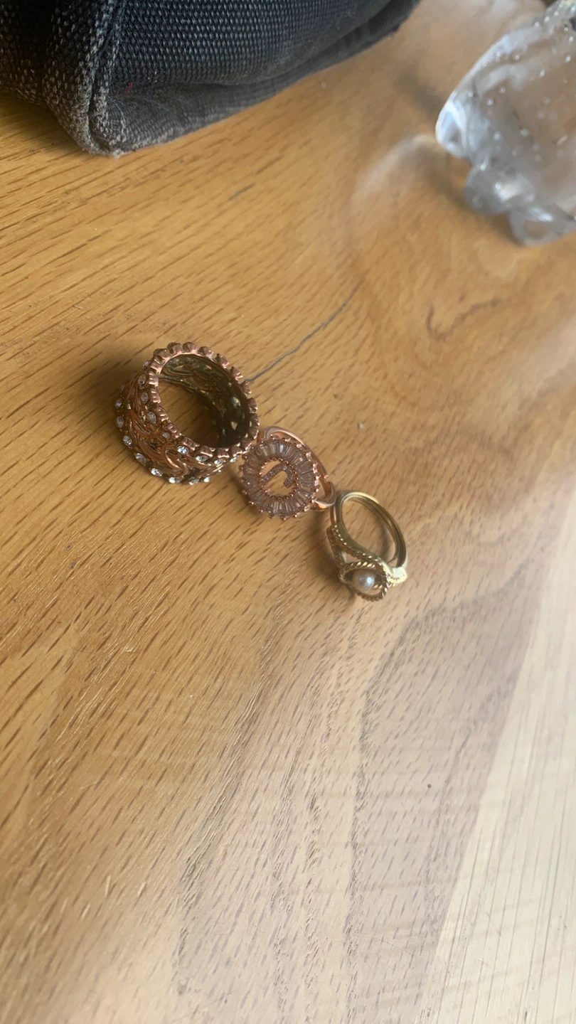 Gold tone watch and 3 rings
