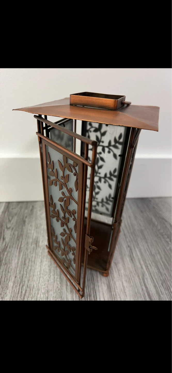 Copper-toned Metal Lantern with Decorative Leaf Design